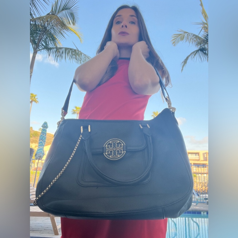 Black, gold chain Tory Burch bag.  The classic professional.